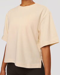 Woman wearing AfterDark ZeroCrease Cropped Tee - Vanilla Bean | Model:Jordan | Size:XS | Thumbnail Index: 1