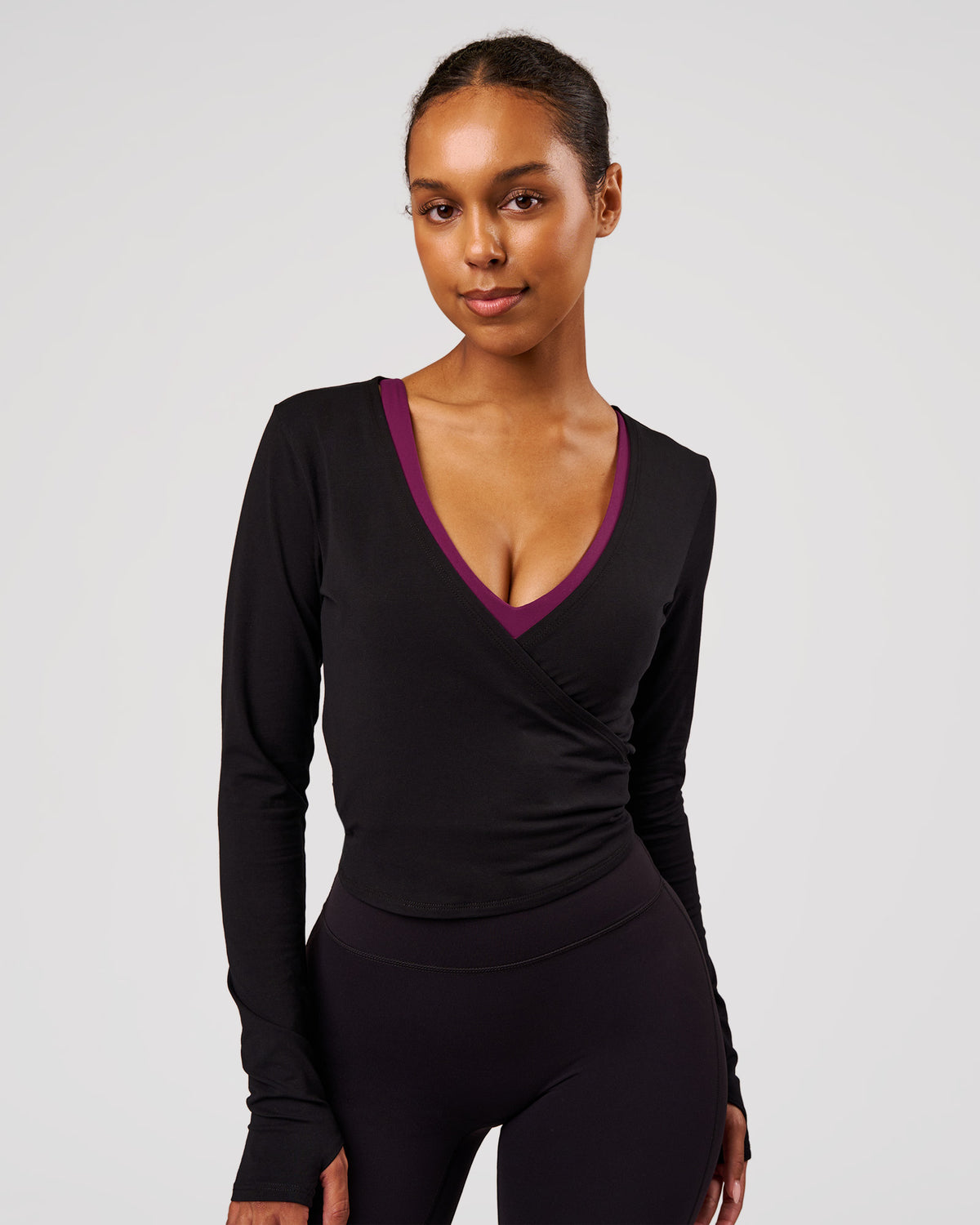 Woman wearing All Day Wrap FLXCotton Long Sleeve Top - Black | Model:Jordan | Size:XS