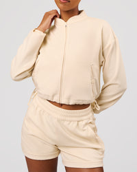 Woman wearing CloudWaffle Midi Zip Up - Vanilla Bean | Model:Jordan | Size:XS | Thumbnail Index: 2