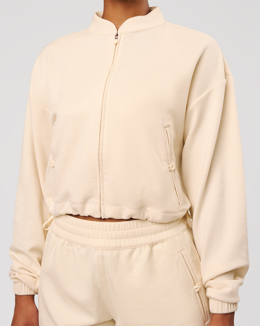 Woman wearing CloudWaffle Midi Zip Up - Vanilla Bean | Model:Jordan | Size:XS - view 4