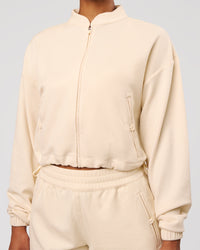 Woman wearing CloudWaffle Midi Zip Up - Vanilla Bean | Model:Jordan | Size:XS | Thumbnail Index: 3