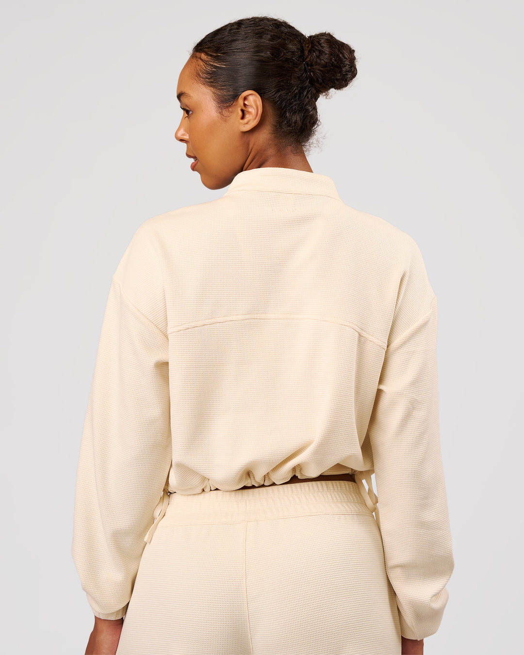 Woman wearing CloudWaffle Midi Zip Up - Vanilla Bean | Model:Jordan | Size:XS - view 6