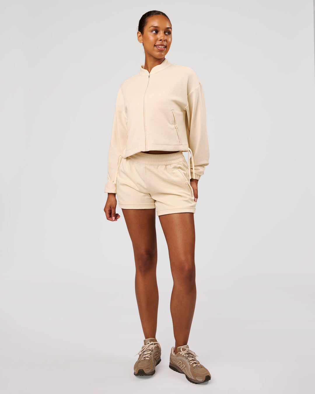 Woman wearing CloudWaffle Midi Zip Up - Vanilla Bean | Model:Jordan | Size:XS - view 7