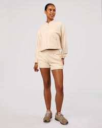 Woman wearing CloudWaffle Midi Zip Up - Vanilla Bean | Model:Jordan | Size:XS | Thumbnail Index: 6