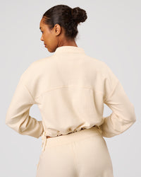 Woman wearing CloudWaffle Midi Zip Up - Vanilla Bean | Model:Jordan | Size:XS | Thumbnail Index: 7