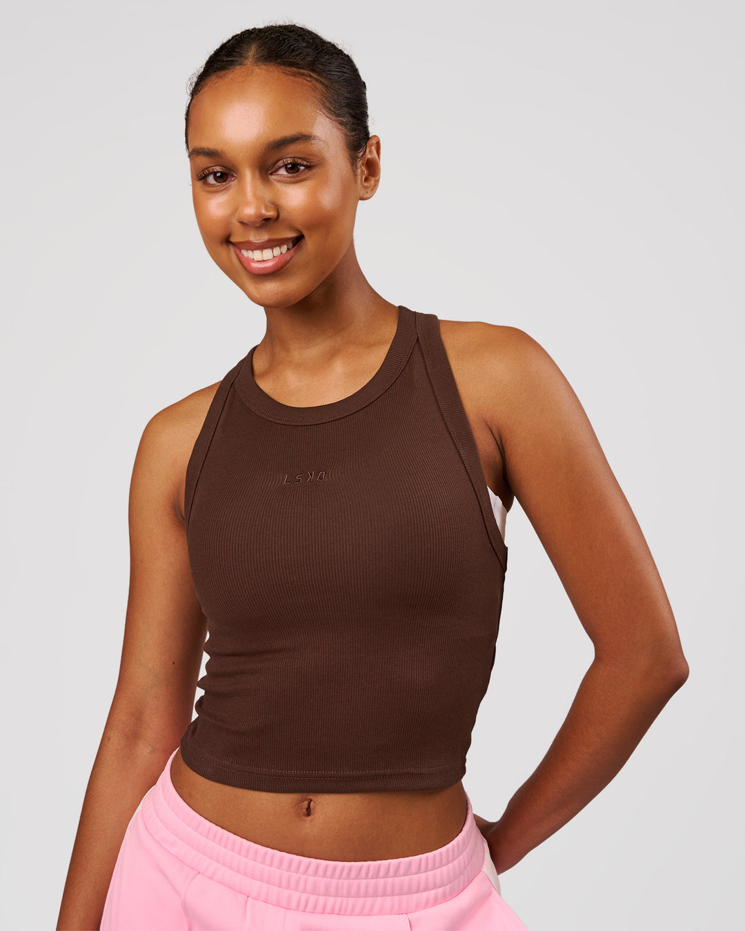Woman wearing Go-To FLXCotton Rib Crop Tank - Hot Chocolate | Model:Jordan | Size:XS - view 1