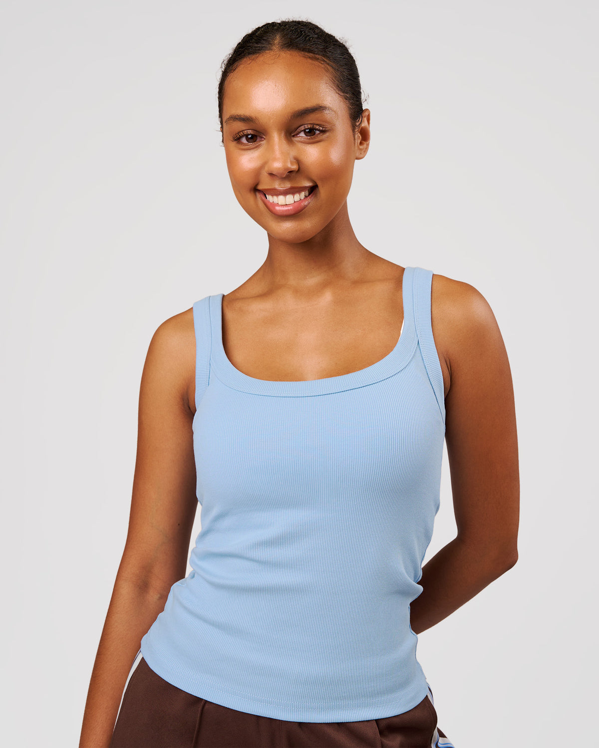 Woman wearing Go-To FLXCotton Rib Scoop Tank - Open Air | Model:Jordan | Size:XS