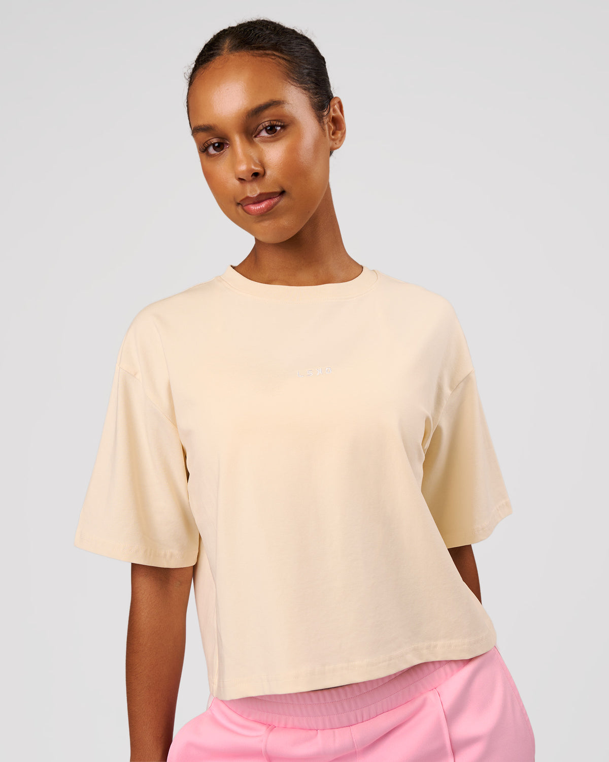 Woman wearing Go-To Heavyweight FlxCotton Skimmer Tee - Vanilla Bean-White | Model:Jordan | Size:XS