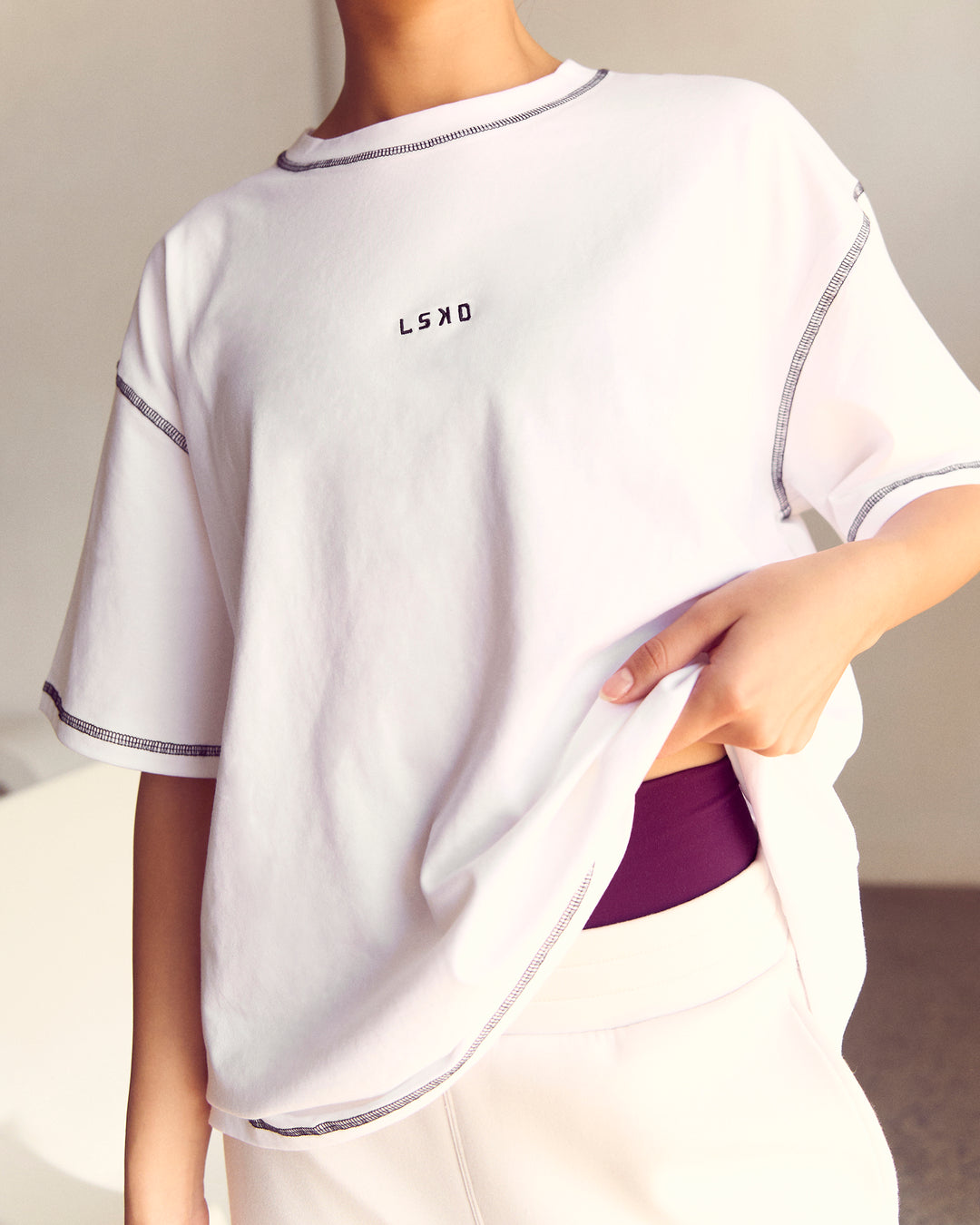 Woman wearing Go-To Contrast Oversized Heavyweight FLXCotton Tee - White-Black | Model:Kenni | Size:XS - view 2