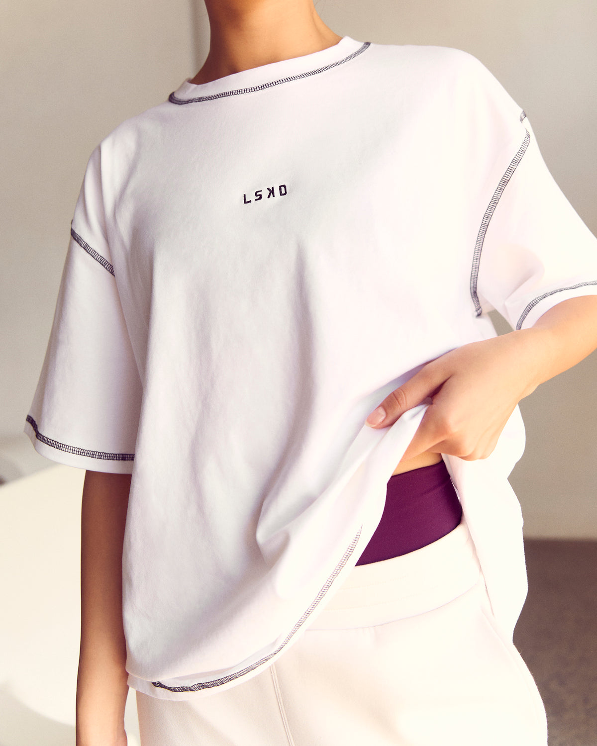 Woman wearing Go-To Contrast Oversized Heavyweight FLXCotton Tee - White-Black | Model:Kenni | Size:XS