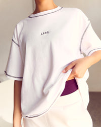 Woman wearing Go-To Contrast Oversized Heavyweight FLXCotton Tee - White-Black | Model:Kenni | Size:XS | Thumbnail Index: 1