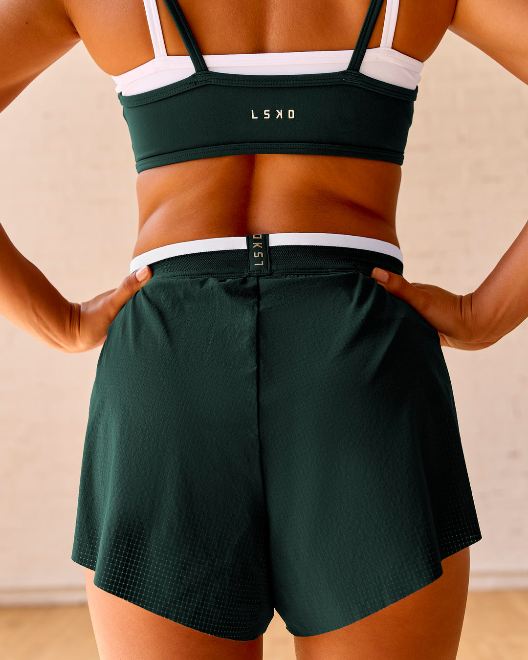 Woman wearing Trackline Accelerate 3" High-Rise Running Short - Midnight Green-White | Model:Meg | Size:XS - view 4