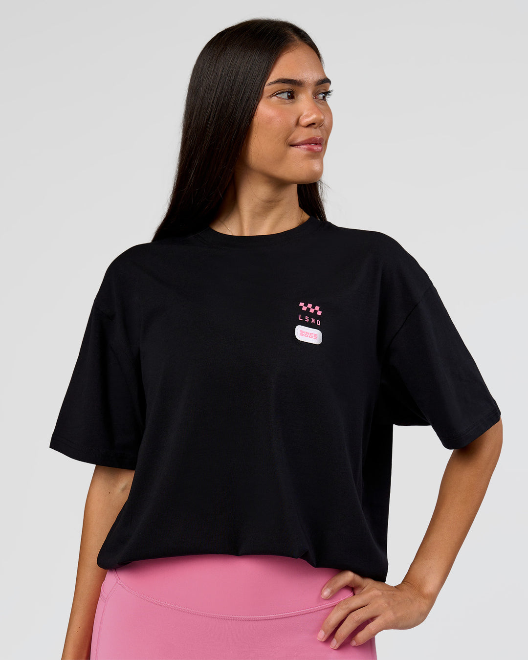 Woman wearing Archive FLXCotton Oversized Tee - Black-Candy Pink | Model:Rhiley | Size:XS - view 9