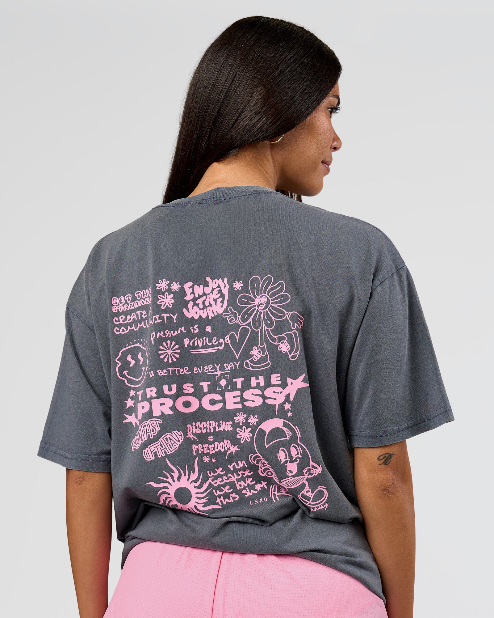 Woman wearing Built On Values FLXCotton Oversized Tee - Dark Storm Washed-Pink Rose | Model:Rhiley | Size:XS