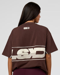 Woman wearing Inline Heavyweight FLXCotton Oversized Tee - Hot Chocolate-Off White | Model:Rhiley | Size:XS | Thumbnail Index: 2