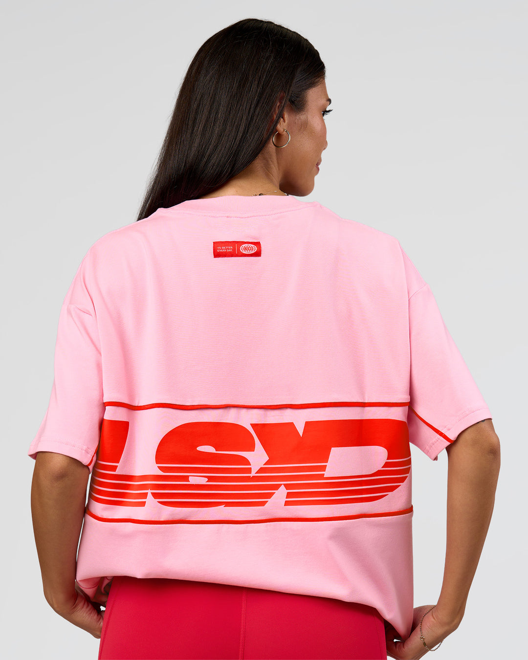 Woman wearing Inline Heavyweight FLXCotton Oversized Tee - Pink Rose-Flame | Model:Rhiley | Size:XS - view 3
