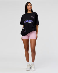 Woman wearing League Heavyweight FLXCotton Oversized Tee - Black-Power Cobalt | Model:Rhiley | Size:XS