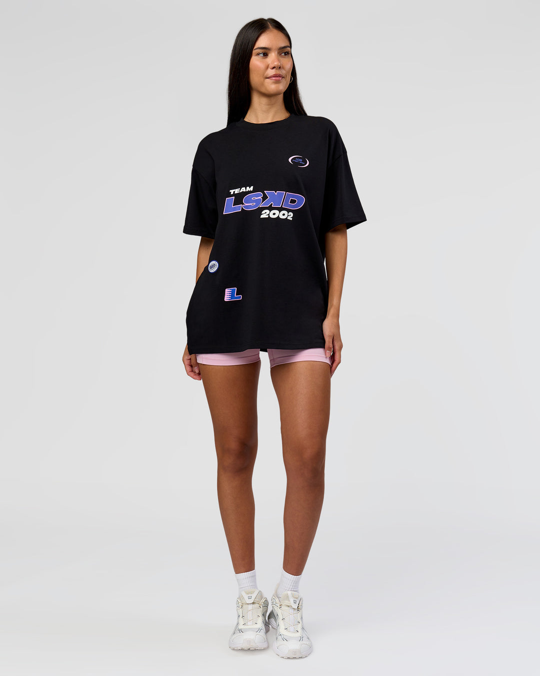 Woman wearing League Heavyweight FLXCotton Oversized Tee - Black-Power Cobalt | Model:Rhiley | Size:XS
