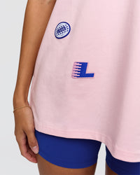Woman wearing League Heavyweight FLXCotton Oversized Tee - Marshmallow-Power Cobalt | Model:Rhiley | Size:XS