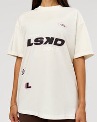 Woman wearing League Heavyweight FLXCotton Oversized Tee - Off White-Ground Coffee | Model:Rhiley | Size:XS