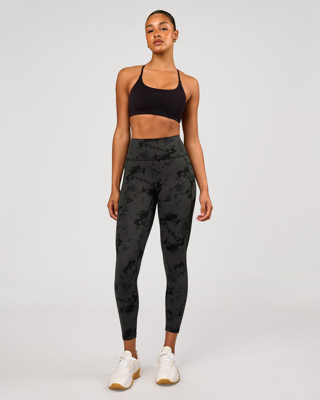 Woman wearing Fusion Ultra High-Rise 7/8 Legging Pockets - Obsidian/Black Tye Dye | Model:Rosie | Size:XS - view 5