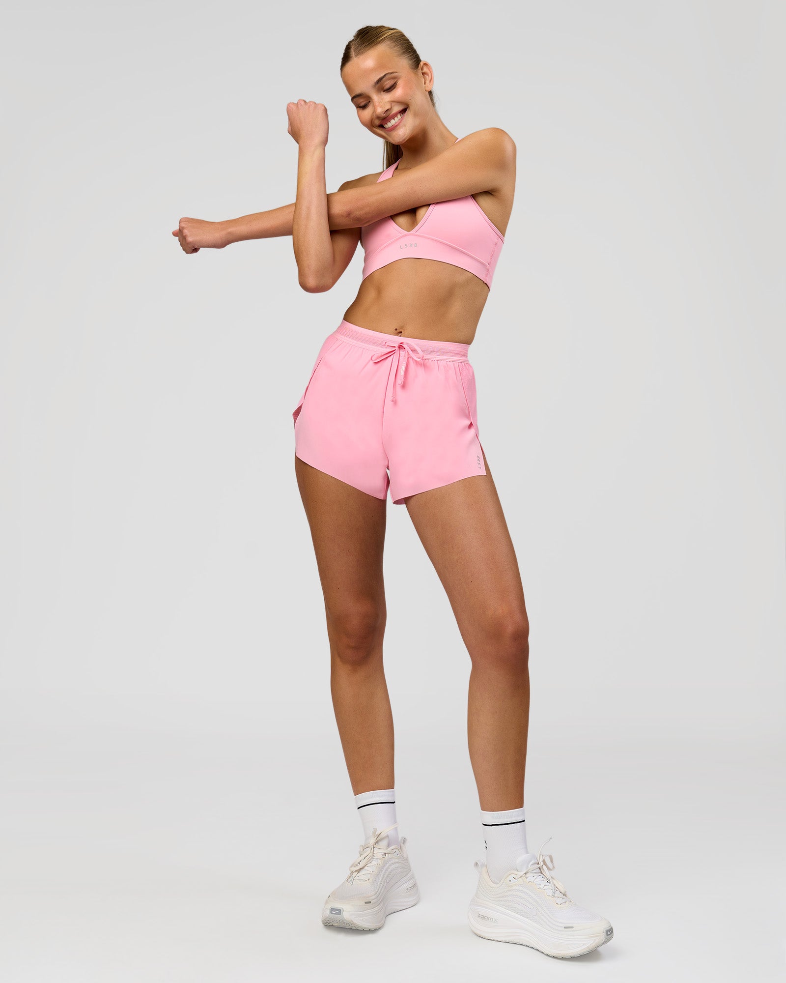 Woman wearing Accelerate 3" High-Rise Running Short - Pink Rose | Model:Taneisha | Size:XS