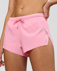 Woman wearing Accelerate 3" Mid-Rise Running Short - Pink Rose | Model:Taneisha | Size:XS