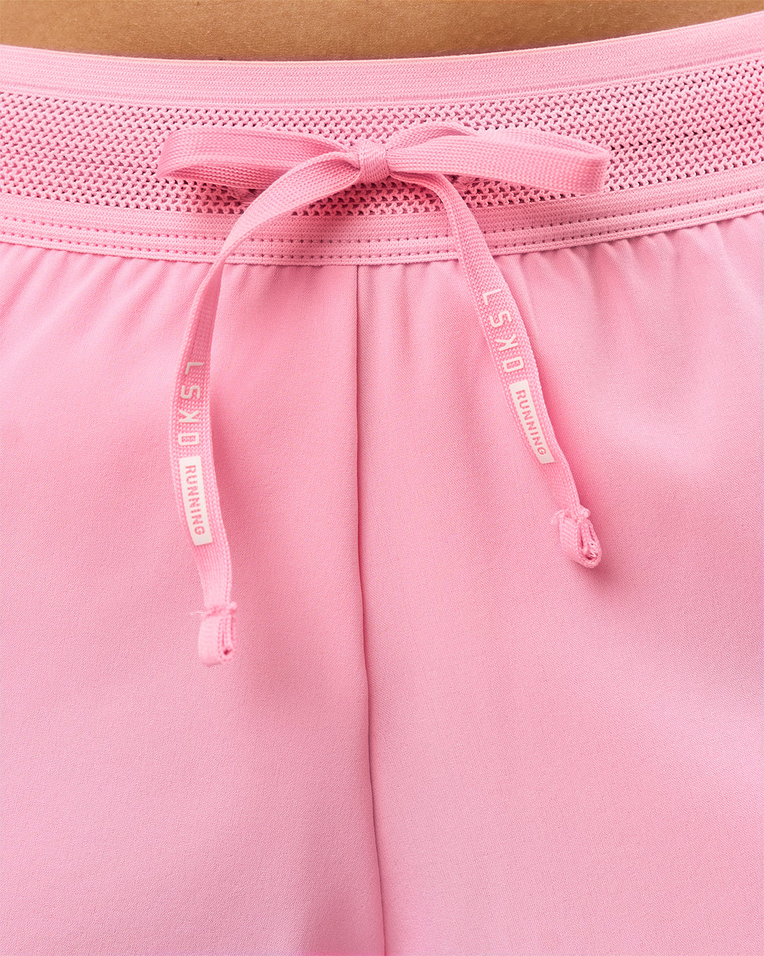 Woman wearing Accelerate 3" Mid-Rise Running Short - Pink Rose | Model:Taneisha | Size:XS
