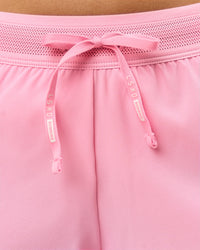 Woman wearing Accelerate 3" Mid-Rise Running Short - Pink Rose | Model:Taneisha | Size:XS