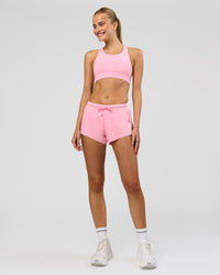 Woman wearing Accelerate 3" Mid-Rise Running Short - Pink Rose | Model:Taneisha | Size:XS