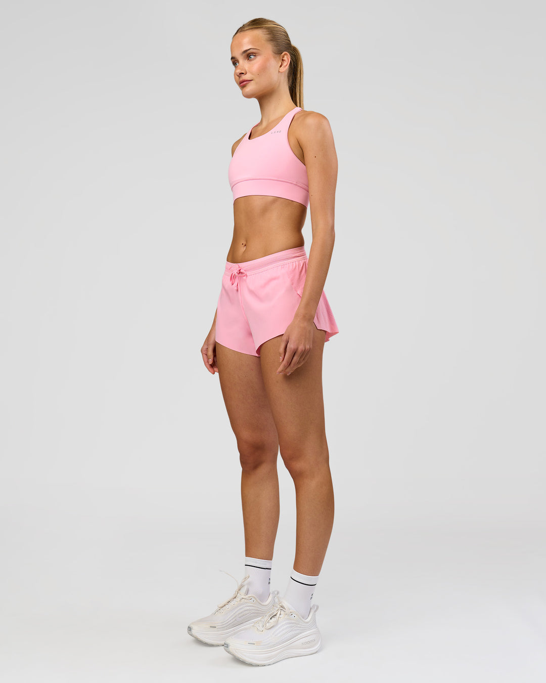 Woman wearing Accelerate 3" Mid-Rise Running Short - Pink Rose | Model:Taneisha | Size:XS