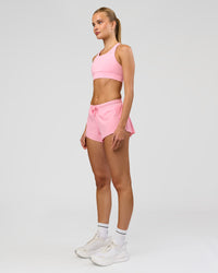 Woman wearing Accelerate 3" Mid-Rise Running Short - Pink Rose | Model:Taneisha | Size:XS