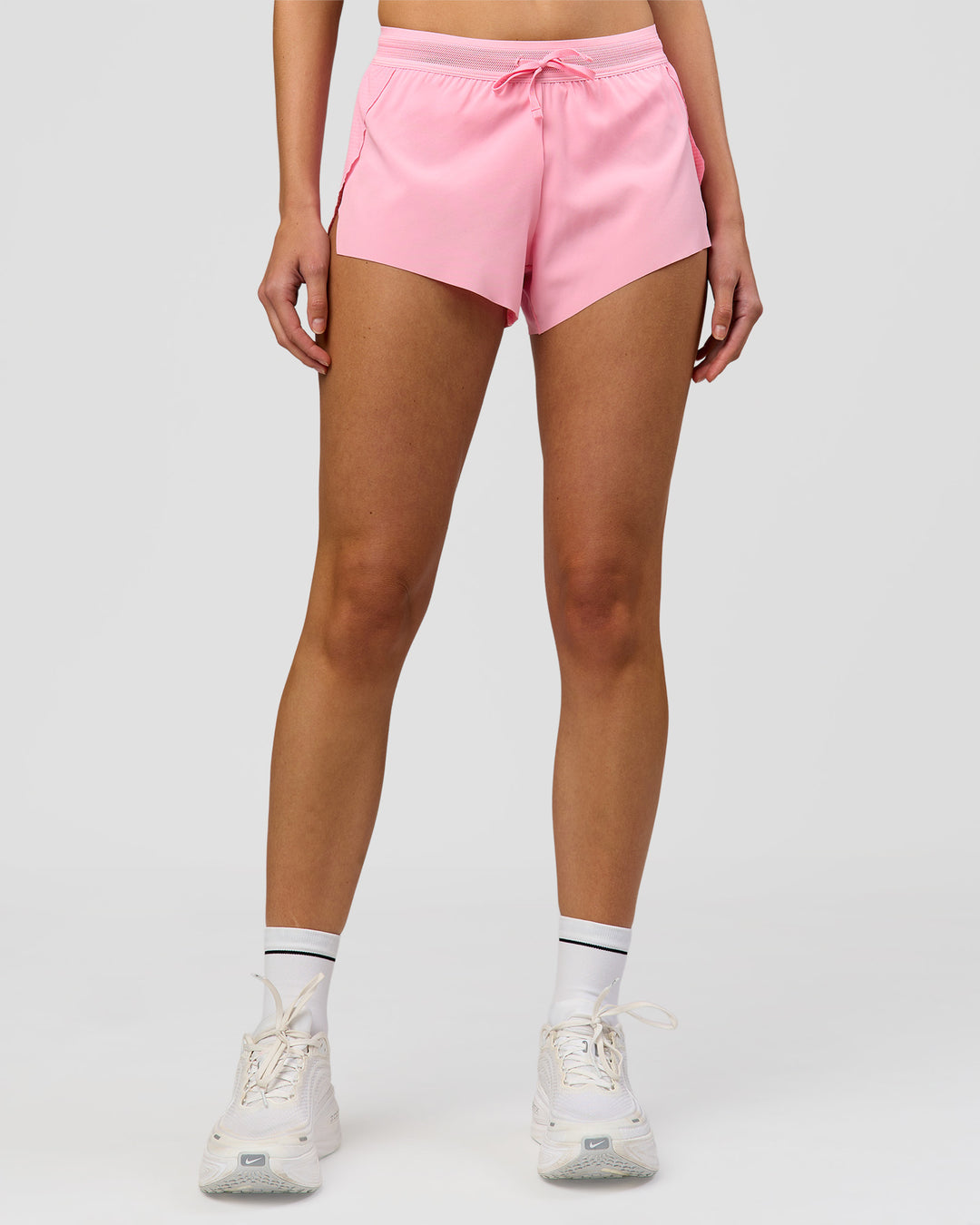 Woman wearing Accelerate 3" Mid-Rise Running Short - Pink Rose | Model:Taneisha | Size:XS