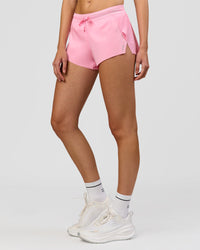 Woman wearing Accelerate 3" Mid-Rise Running Short - Pink Rose | Model:Taneisha | Size:XS