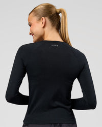 Woman wearing AeroFLX+ Seamless Long Sleeve Tee - Black Marl | Model:Taneisha | Size:XS | Thumbnail Index: 3