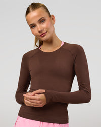 Woman wearing AeroFLX+ Seamless Long Sleeve Tee - Hot Chocolate/Hot Chocolate | Model:Taneisha | Size:XS | Thumbnail Index: 0