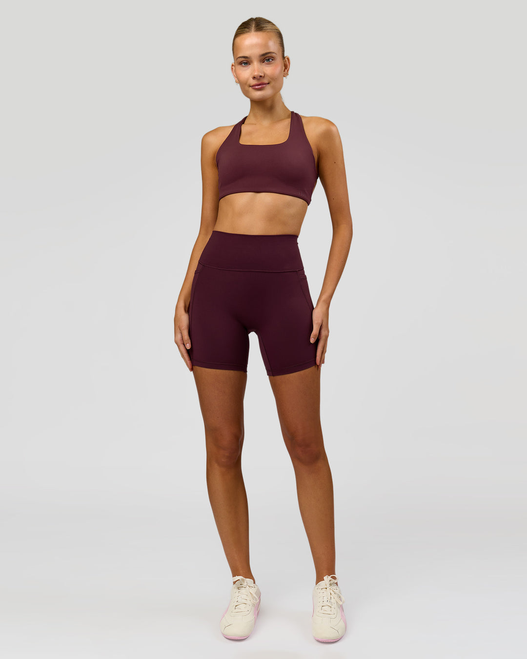 Woman wearing Aspire Sports Bra - Cherry Lacquer | Model:Taneisha | Size:XS - view 4
