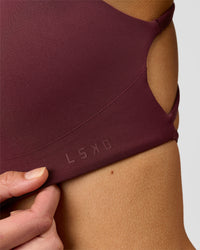 Woman wearing Aspire Sports Bra - Cherry Lacquer | Model:Taneisha | Size:XS | Thumbnail Index: 4