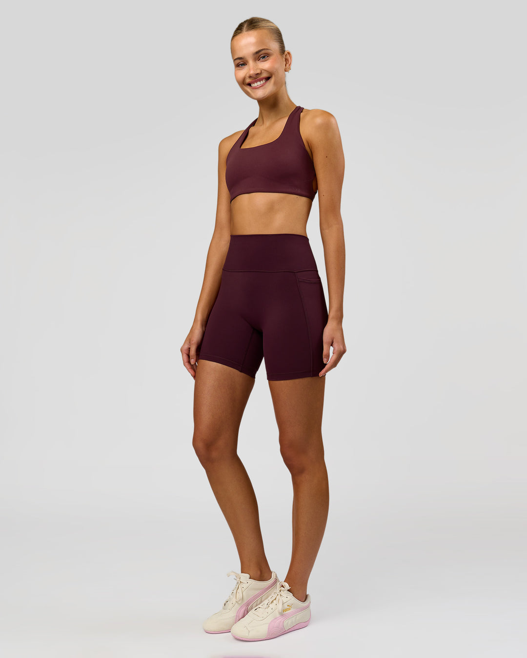 Woman wearing Aspire Sports Bra - Cherry Lacquer | Model:Taneisha | Size:XS - view 6