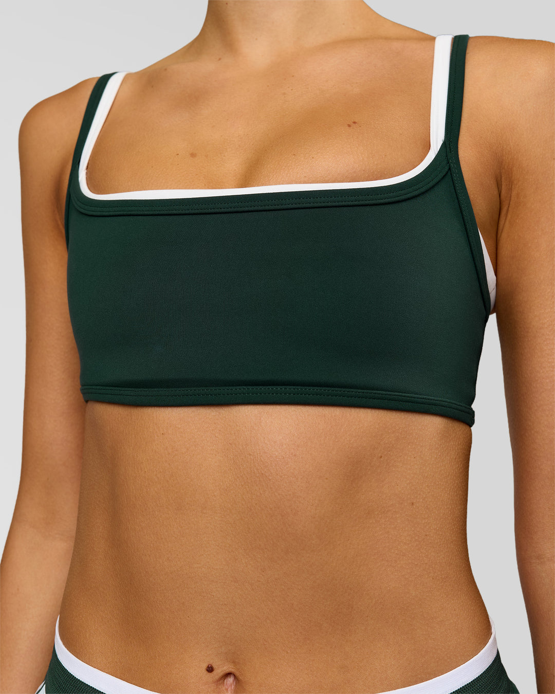 Woman wearing Balance Sports Bra - Midnight Green-White | Model:Taneisha | Size:XS - view 4