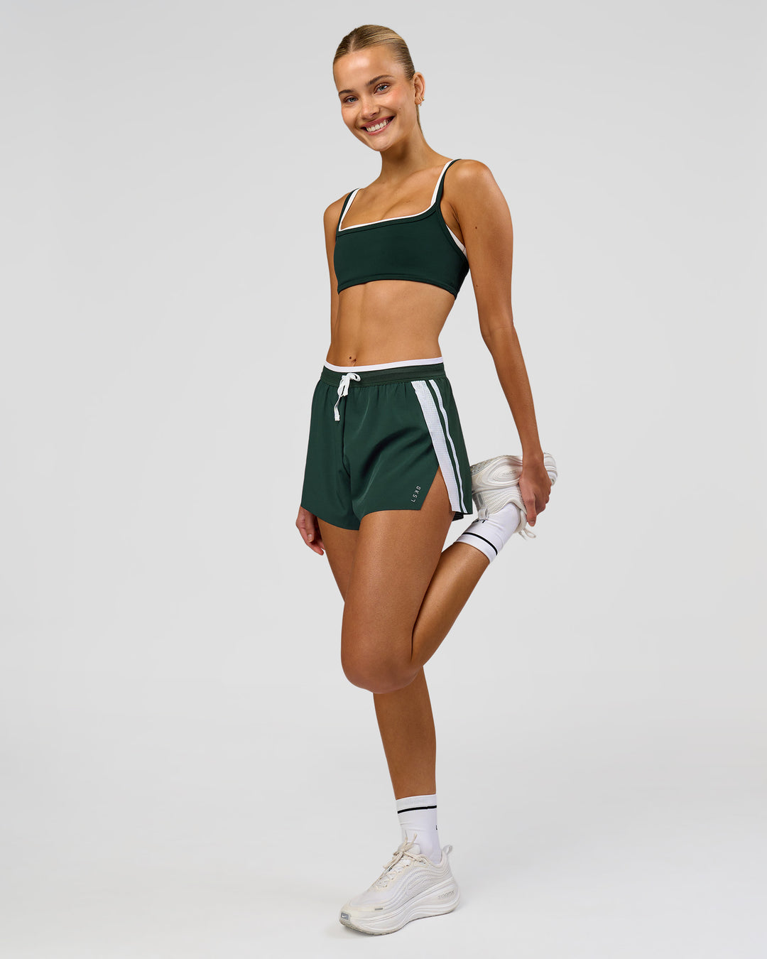 Woman wearing Balance Sports Bra - Midnight Green-White | Model:Taneisha | Size:XS - view 6