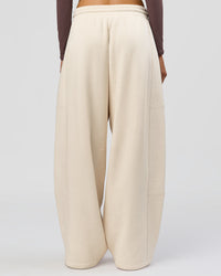 Woman wearing Bree Barrel Fleece Track Pant - Vanilla Bean | Model:Taneisha | Size:XS | Thumbnail Index: 4