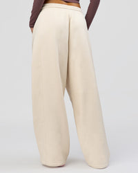 Woman wearing Bree Barrel Fleece Track Pant - Vanilla Bean | Model:Taneisha | Size:XS | Thumbnail Index: 8