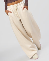 Woman wearing Bree Barrel Fleece Track Pant - Vanilla Bean | Model:Taneisha | Size:XS | Thumbnail Index: 11