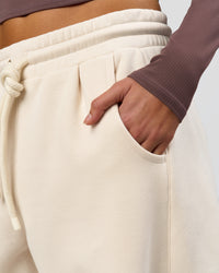 Woman wearing Bree Barrel Fleece Track Pant - Vanilla Bean | Model:Taneisha | Size:XS | Thumbnail Index: 12