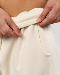 Woman wearing Bree Barrel Fleece Track Pant - Vanilla Bean | Model:Taneisha | Size:XS | Thumbnail Index: 13