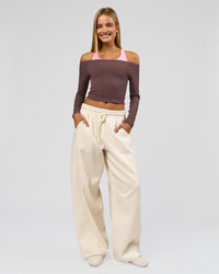 Woman wearing Bree Barrel Fleece Track Pant - Vanilla Bean | Model:Taneisha | Size:XS | Thumbnail Index: 0