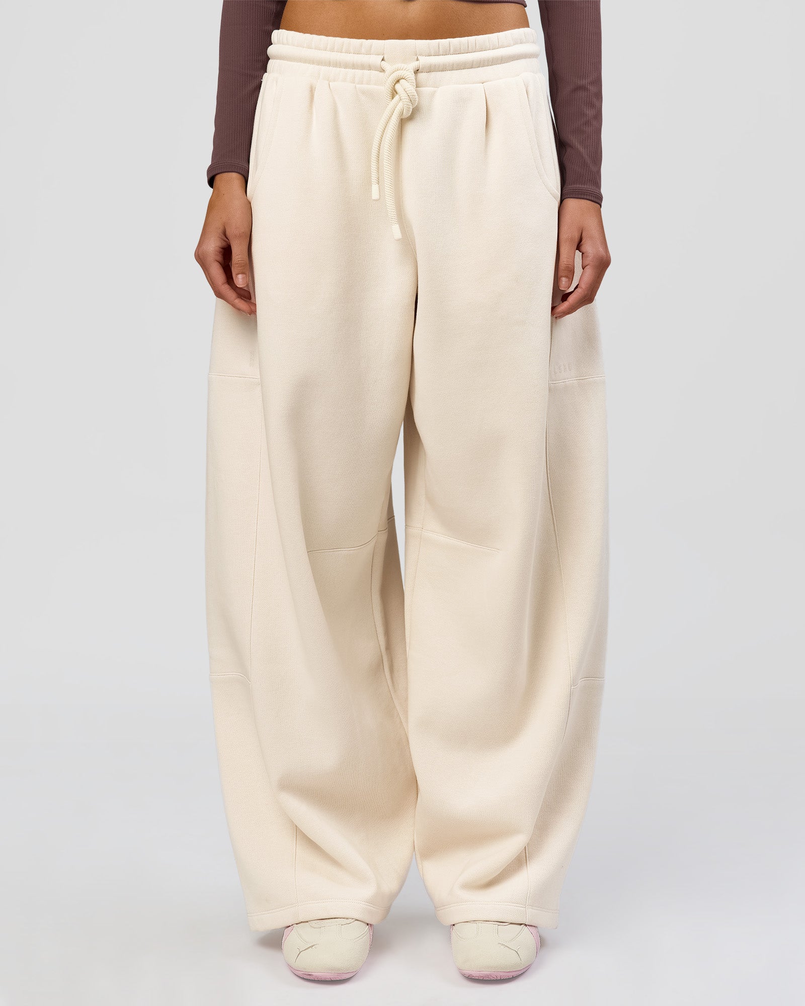 Woman wearing Bree Barrel Fleece Track Pant - Vanilla Bean | Model:Taneisha | Size:XS