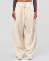 Woman wearing Bree Barrel Fleece Track Pant - Vanilla Bean | Model:Taneisha | Size:XS | Thumbnail Index: 1