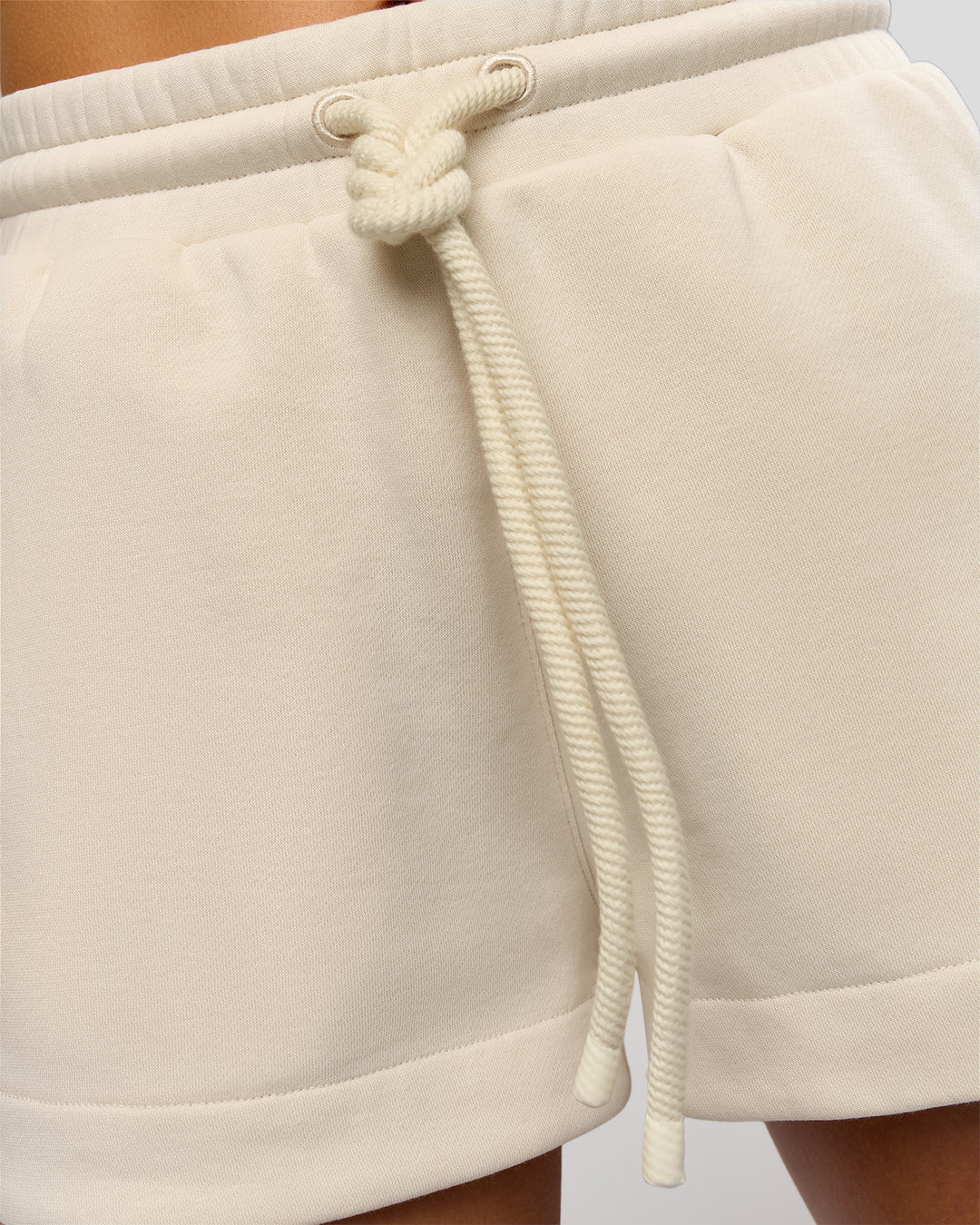 Woman wearing Bree Fleece Track Short - Vanilla Bean | Model:Taneisha | Size:XS - view 10